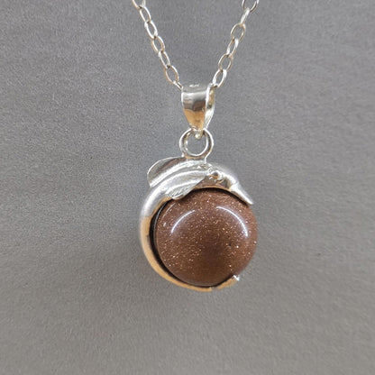 Sterling Silver Goldstone Oval Pendant with Sterling silver dolphin vintage